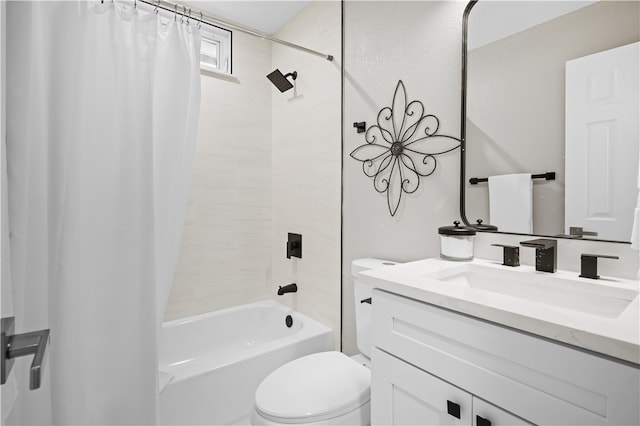 full bathroom featuring shower / bath combo, vanity, and toilet