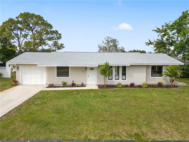 ranch-style home with a garage, a front lawn, concrete driveway, and stucco siding