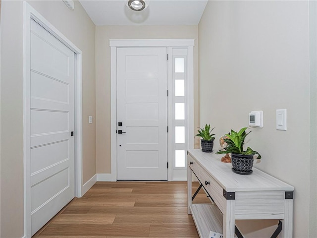 foyer entrance featuring light hardwood / wood-style flooring