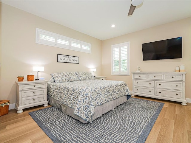 bedroom featuring ceiling fan and light hardwood / wood-style flooring