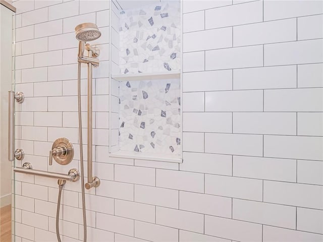 bathroom with tiled shower