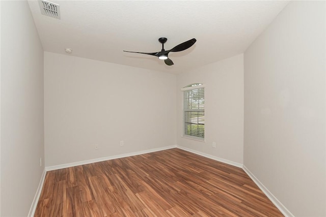 590 Valencia Cir SW, Vero Beach, FL 32968 - unfurnished room with a ceiling fan, wood finished floors, and baseboards