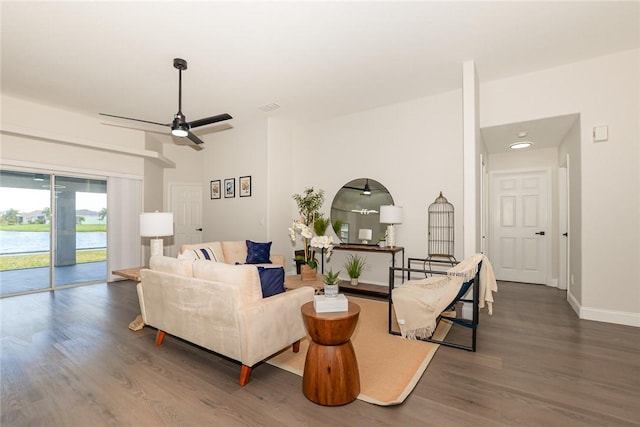 590 Valencia Cir SW, Vero Beach, FL 32968 - living area with a ceiling fan, wood finished floors, and baseboards
