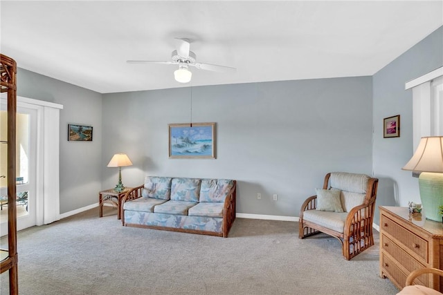 carpeted living room featuring ceiling fan