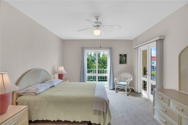 carpeted bedroom featuring french doors, ceiling fan, and access to outside