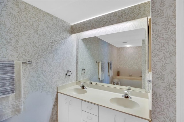 bathroom featuring a bathing tub and vanity