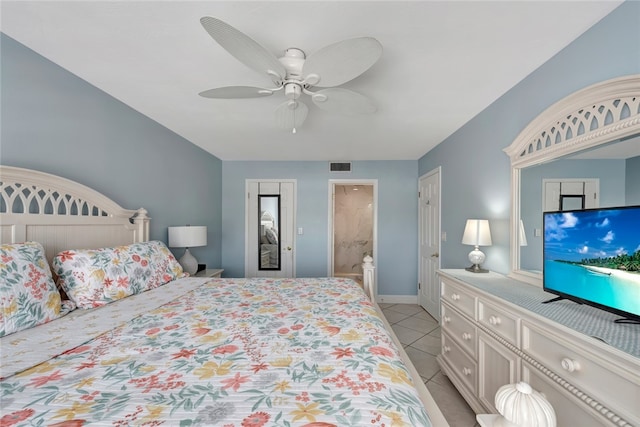 tiled bedroom with a closet and ceiling fan