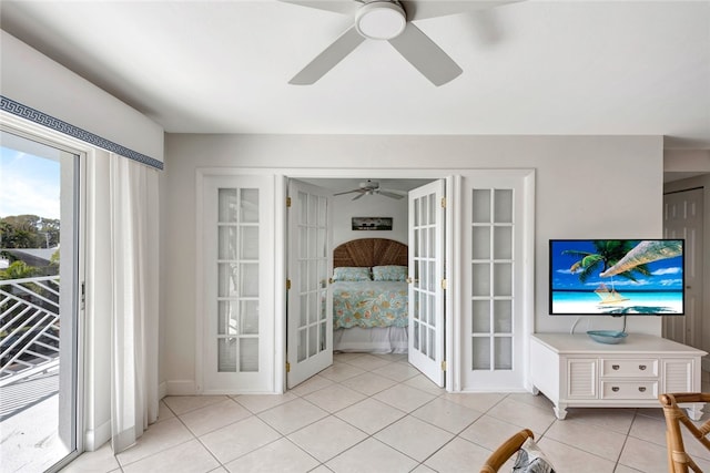 living room with ceiling fan, french doors, and light tile patterned floors