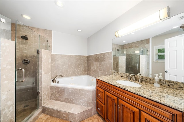 bathroom with vanity, tile patterned floors, and separate shower and tub