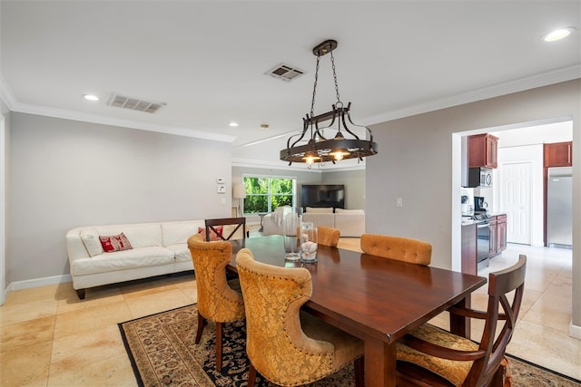 dining room featuring light tile patterned flooring and ornamental molding