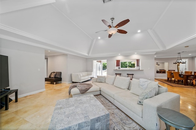 tiled living room featuring ceiling fan and ornamental molding