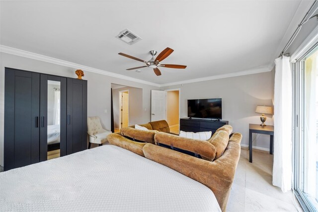 bedroom with ornamental molding and ceiling fan