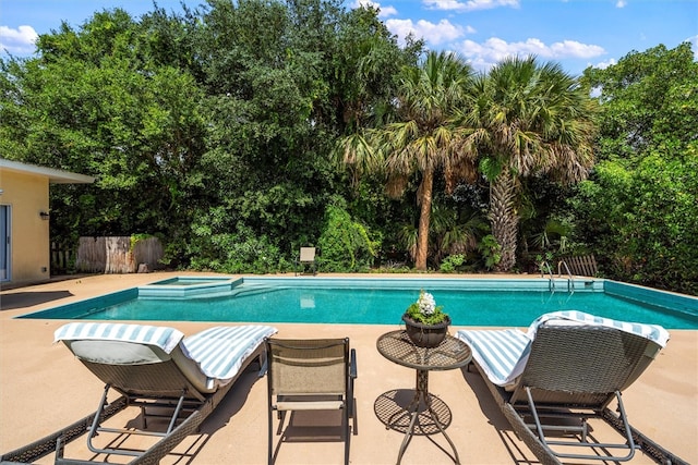 view of pool with an in ground hot tub and a patio area