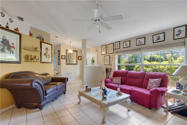 living area with visible vents, baseboards, a ceiling fan, and light tile patterned floors
