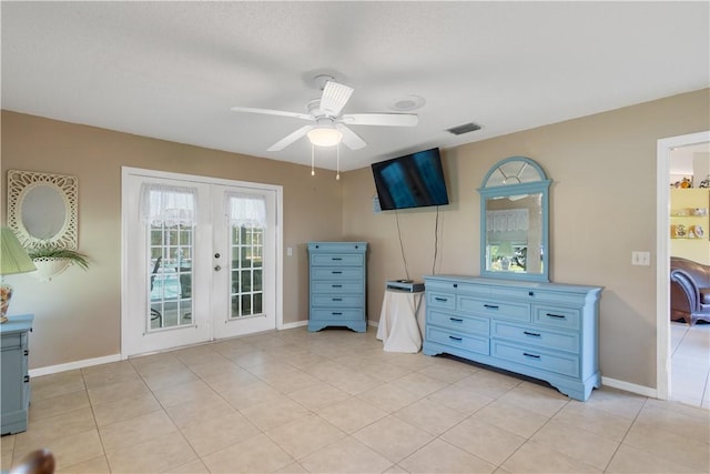 bedroom featuring french doors, visible vents, baseboards, and light tile patterned floors