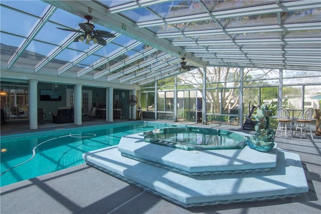 pool with a patio, an indoor hot tub, and a lanai