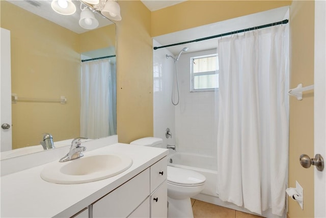 full bath featuring shower / tub combo, vanity, a notable chandelier, tile patterned flooring, and toilet