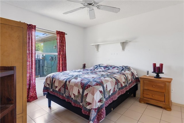 bedroom featuring light tile patterned floors and a ceiling fan