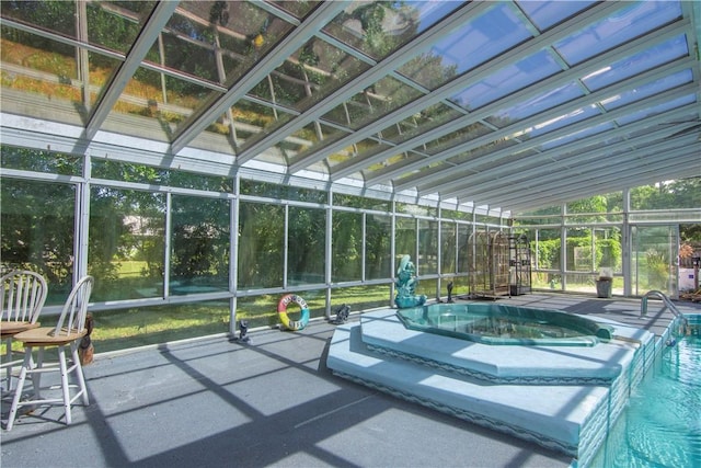unfurnished sunroom featuring a swimming pool and a hot tub