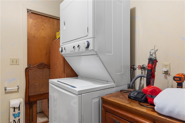 washroom with stacked washer / drying machine