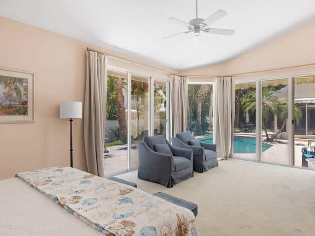 carpeted bedroom featuring access to exterior, multiple windows, lofted ceiling, and ceiling fan