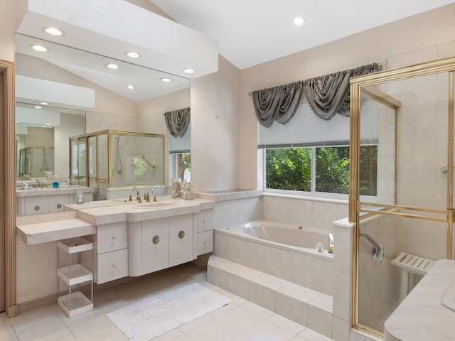 bathroom featuring radiator, vanity, vaulted ceiling, independent shower and bath, and tile patterned flooring