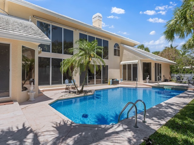 view of pool featuring a patio area