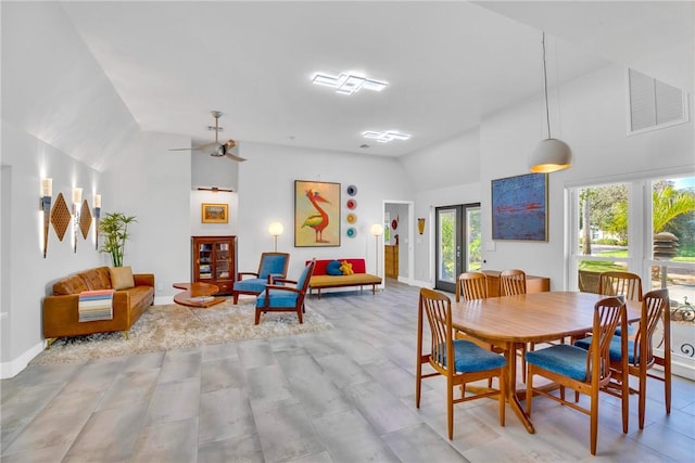 dining area featuring ceiling fan, lofted ceiling, and french doors