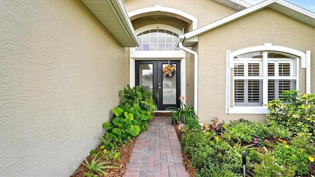 585 Birch Ct, Sebastian, FL 32958 - doorway to property with stucco siding and french doors