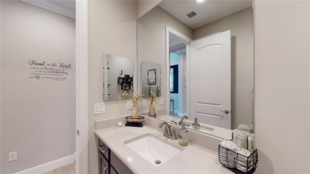 bathroom featuring vanity and wood-type flooring