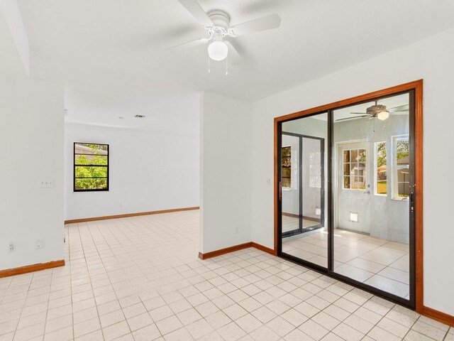 1626 4th Ct, Vero Beach, FL 32960 - spare room with ceiling fan, baseboards, and light tile patterned floors
