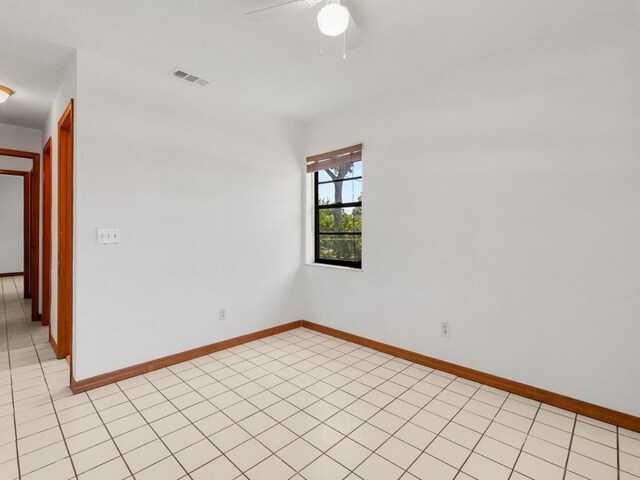 1626 4th Ct, Vero Beach, FL 32960 - spare room with a ceiling fan, baseboards, and light tile patterned floors