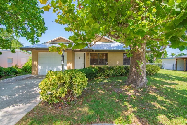 1626 4th Ct, Vero Beach, FL 32960 - ranch-style home with stucco siding, a garage, and driveway