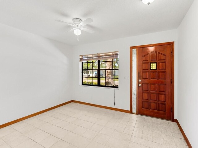1626 4th Ct, Vero Beach, FL 32960 - entrance foyer with a ceiling fan and baseboards
