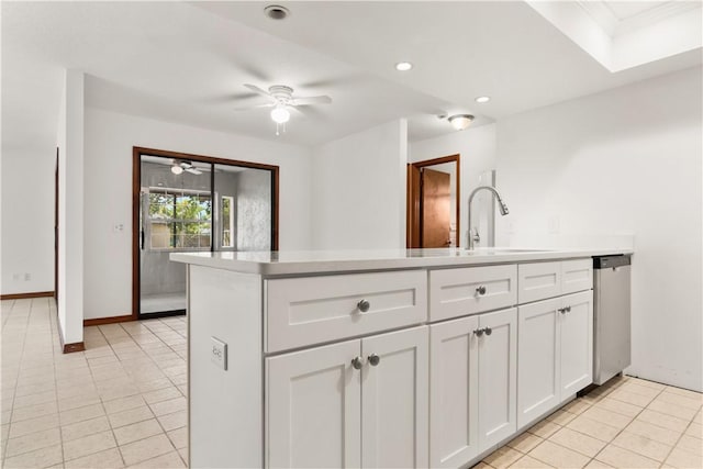 1626 4th Ct, Vero Beach, FL 32960 - kitchen with stainless steel dishwasher, light tile patterned flooring, a sink, a ceiling fan, and recessed lighting