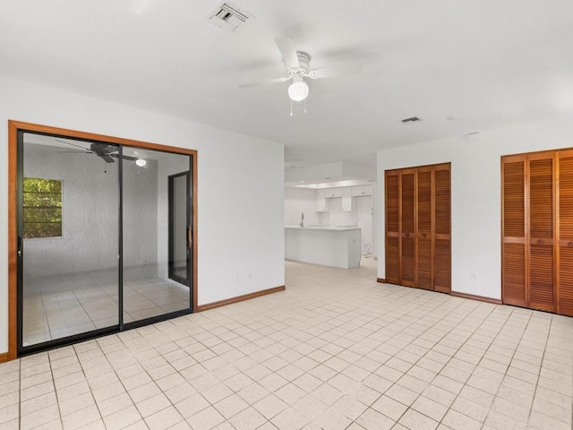 1626 4th Ct, Vero Beach, FL 32960 - unfurnished living room with ceiling fan, baseboards, and light tile patterned floors