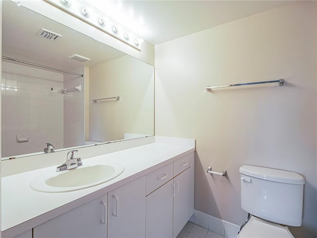 bathroom with tile patterned floors, vanity, and toilet