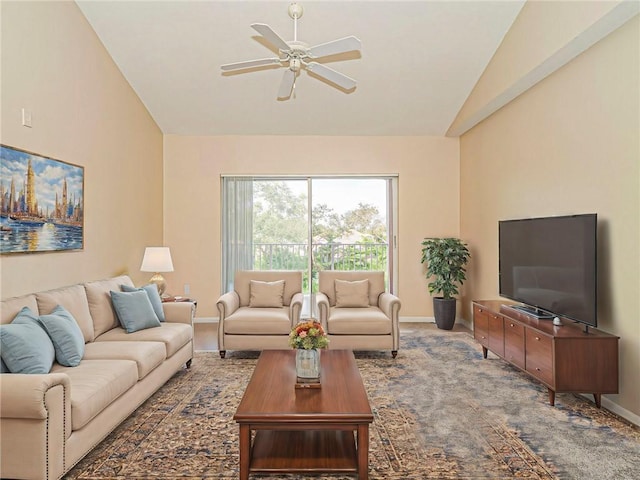 living room featuring ceiling fan and lofted ceiling