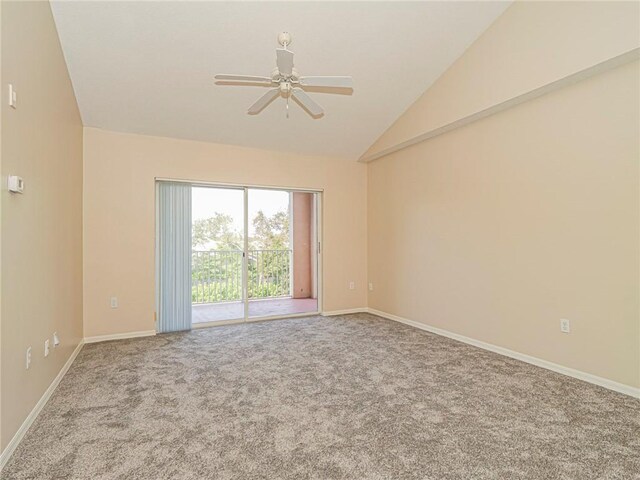 unfurnished room with light colored carpet, vaulted ceiling, and ceiling fan