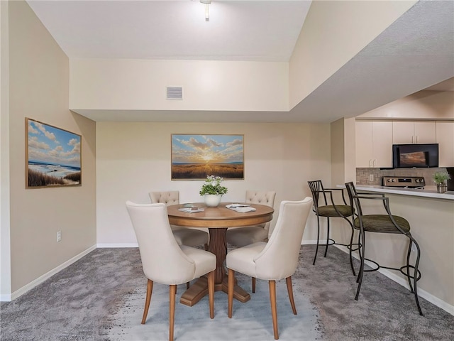 dining space with carpet