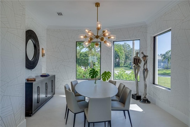 dining room featuring a notable chandelier, light tile patterned flooring, and crown molding