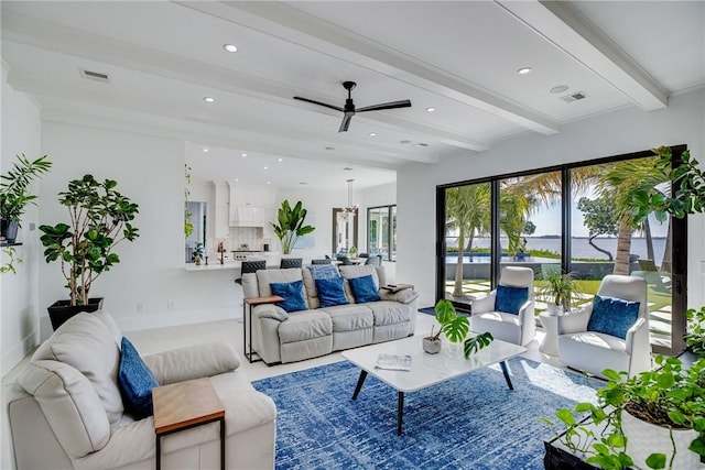 living room with beam ceiling and ceiling fan