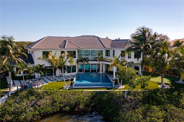 view of pool with a water view