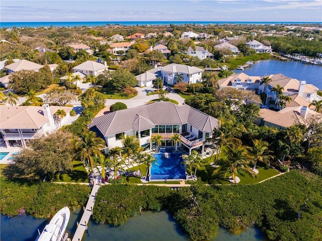 birds eye view of property featuring a water view