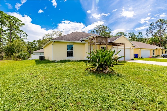 ranch-style house with a front yard, cooling unit, and a garage