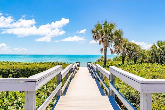 surrounding community featuring a water view