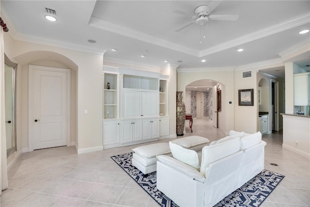 110 Island Plantation Ter Unit 201, Vero Beach, FL 32963 - living area featuring arched walkways, a raised ceiling, a ceiling fan, light tile patterned flooring, and recessed lighting