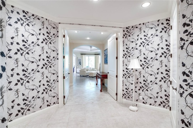 110 Island Plantation Ter Unit 201, Vero Beach, FL 32963 - hallway featuring wallpapered walls, crown molding, arched walkways, baseboards, and recessed lighting