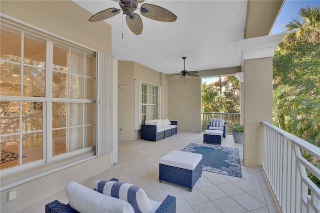 view of patio with an outdoor living space and a ceiling fan