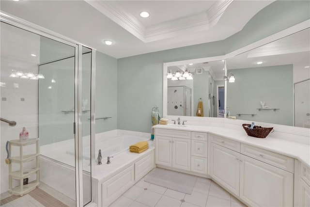 bathroom featuring ornamental molding, a garden tub, a tray ceiling, vanity, and a shower stall